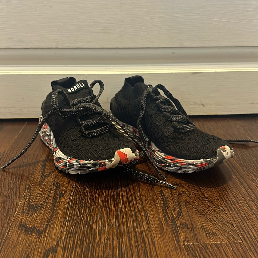 excellent condition black all day Nobull knit trainers
with multi color soles.